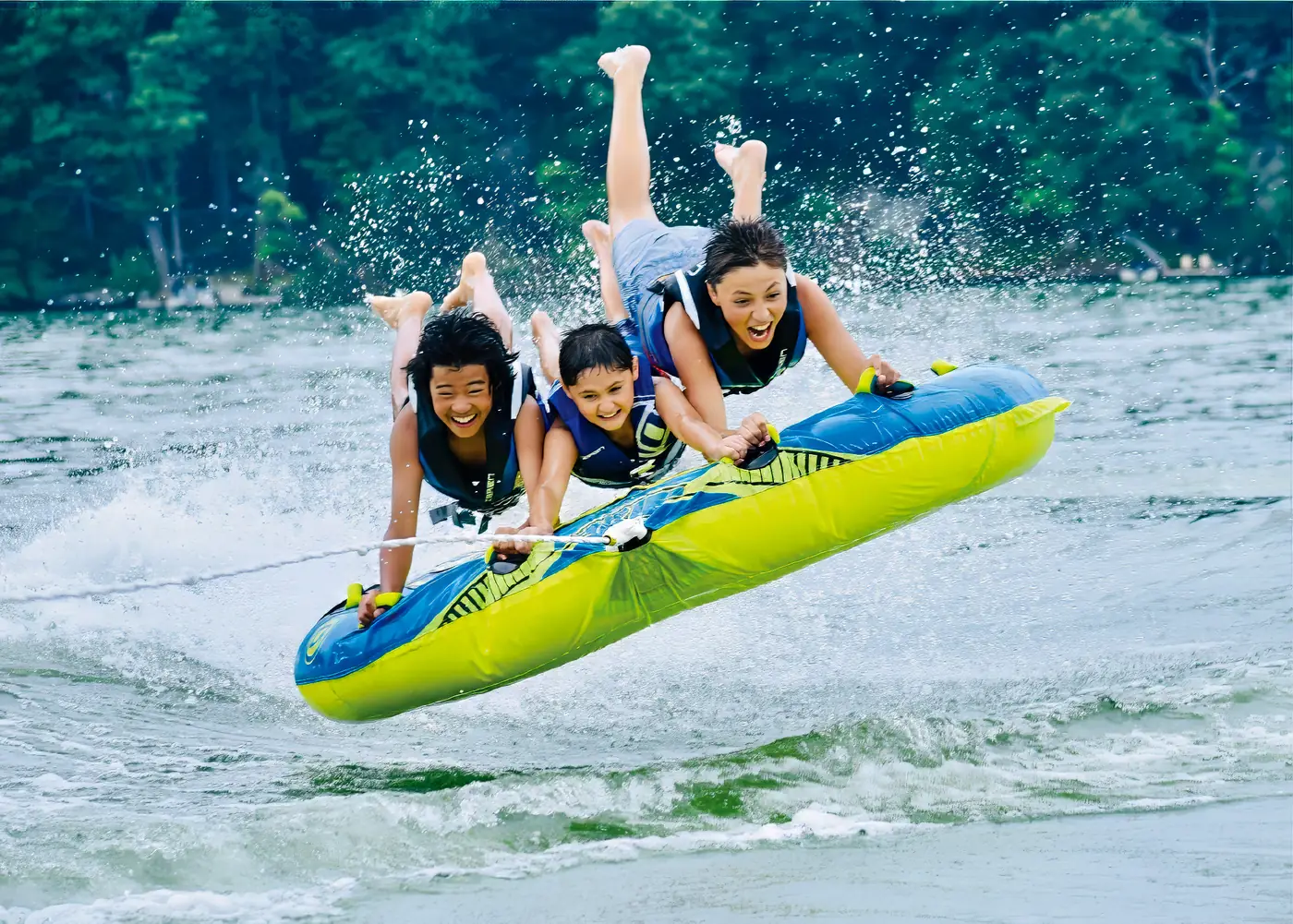 Tubing fun behind a rental wake boat on Candlewood Lake