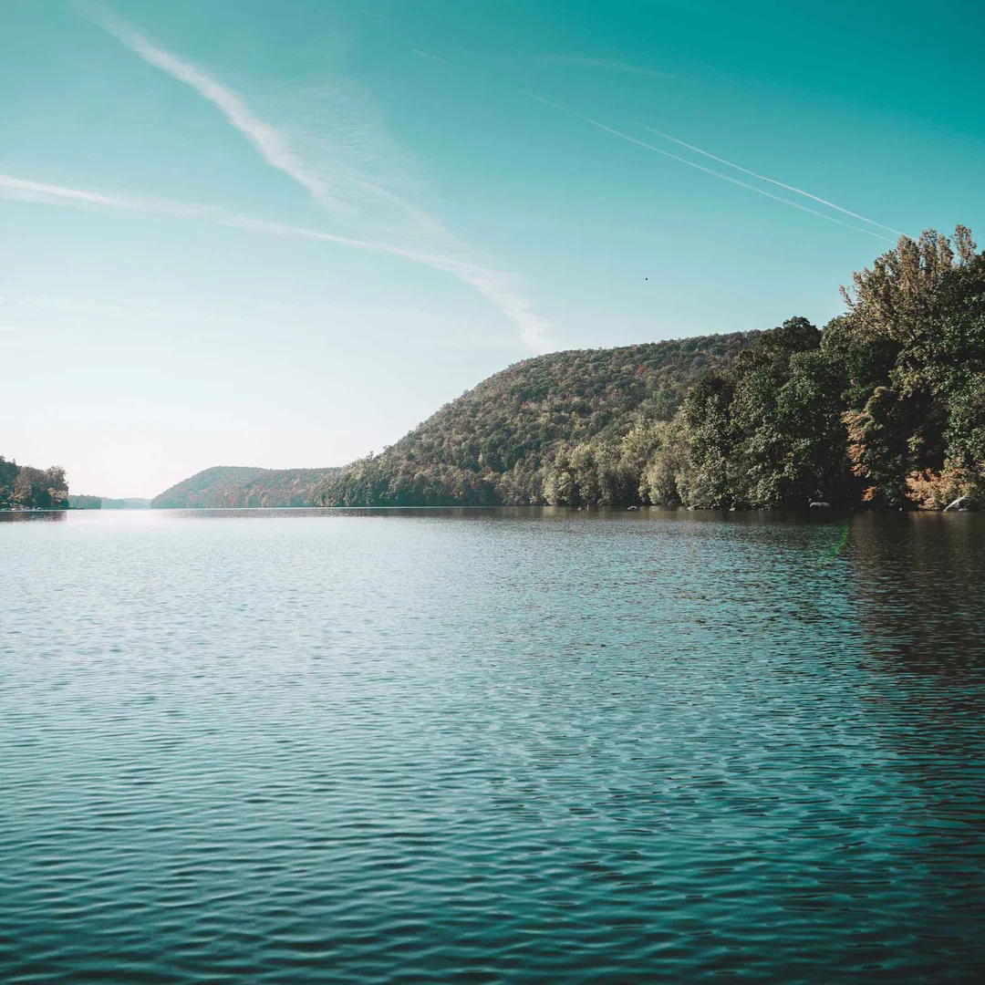 Calm water and wooded shoreline on Candlewood Lake in New Milford, Connecticut