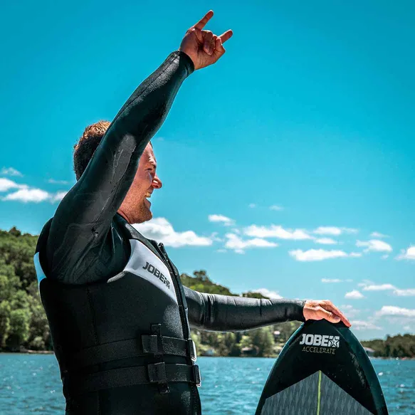 Connor Kostyra, founder of Lakeside Watersports, in a wetsuit on Candlewood Lake
