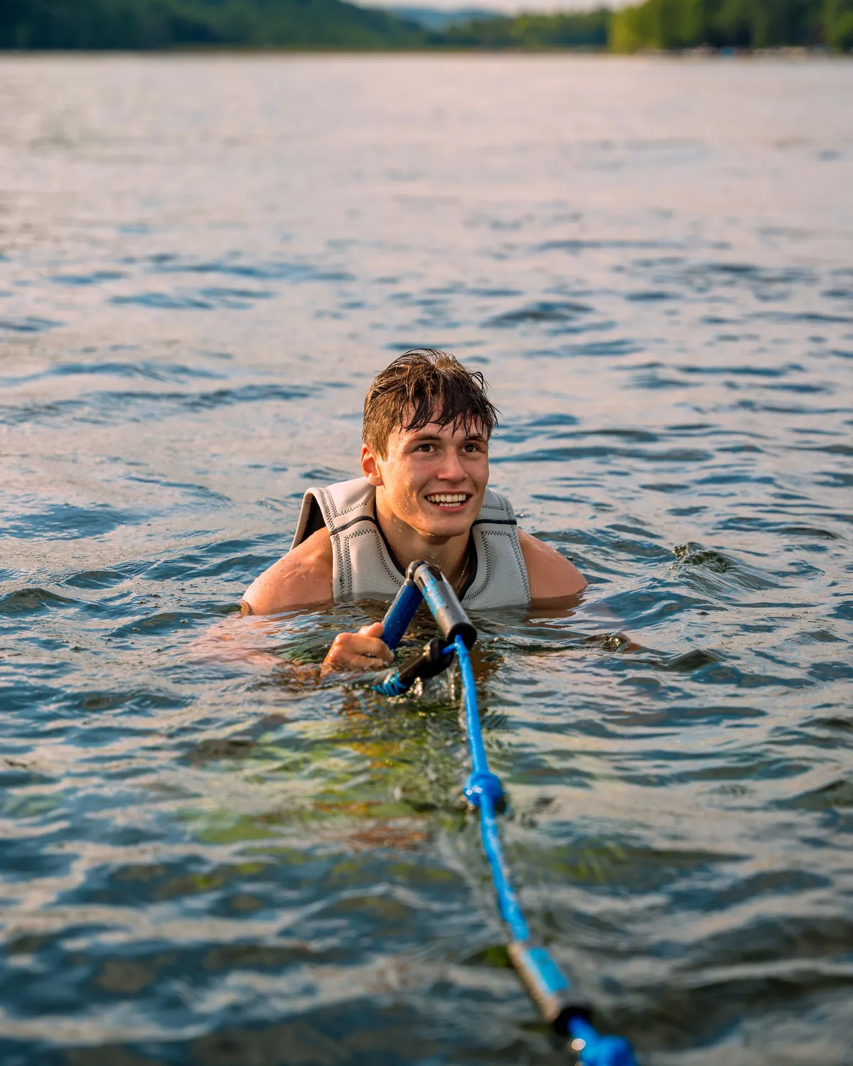 Lakeside Watersports staff member wakesurfing on Candlewood Lake