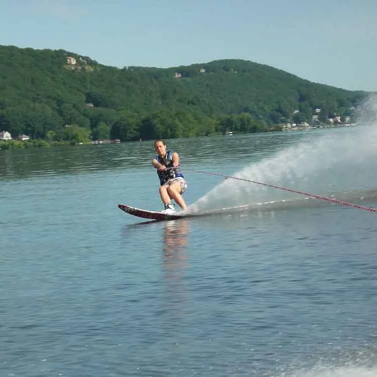 Slalom water skier carving a turn on Candlewood Lake