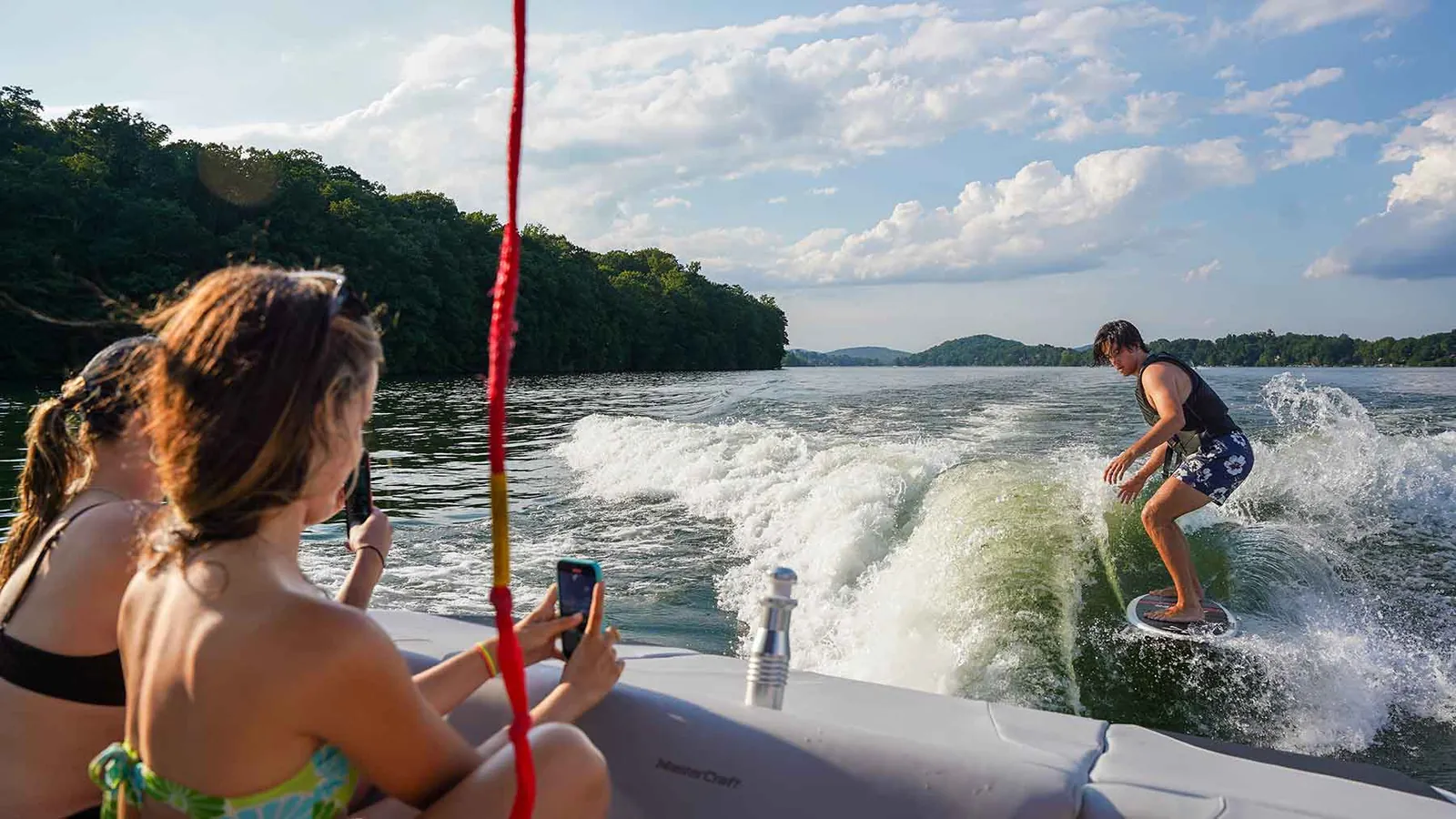Coaching a wakesurfer from the back of the boat on Candlewood Lake
